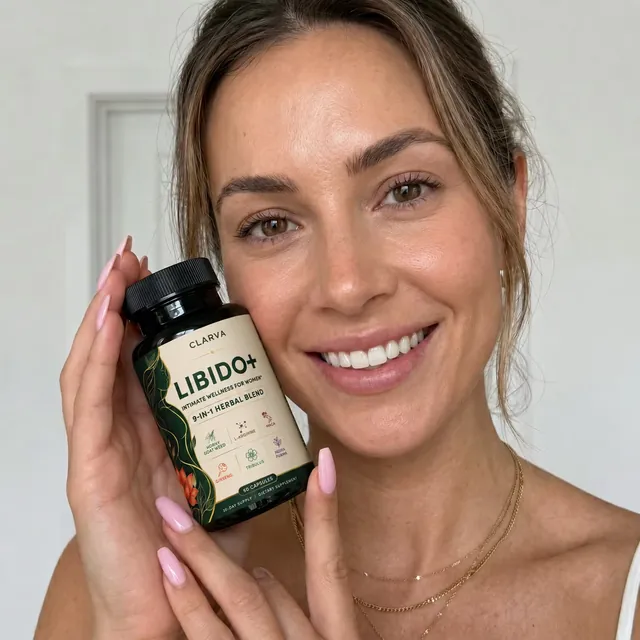 A person holding a CLARVA LIBIDO+ bottle
