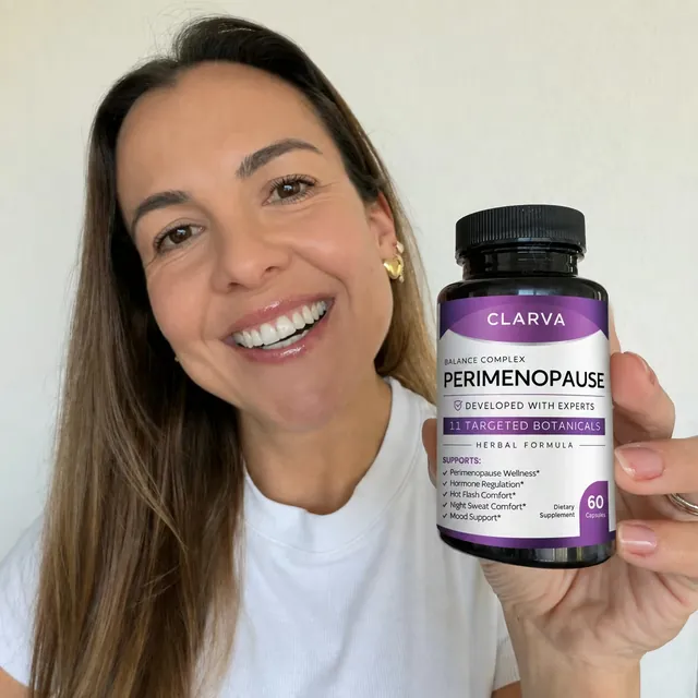 A person holding a CLARVA PERIMENOPAUSE bottle